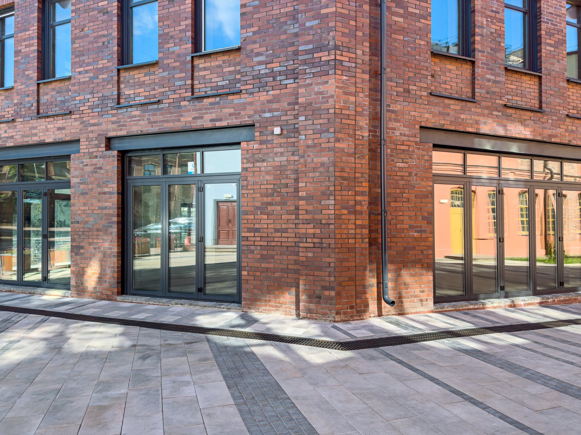 Old red brick industrial buildings after renovation, facade fragment